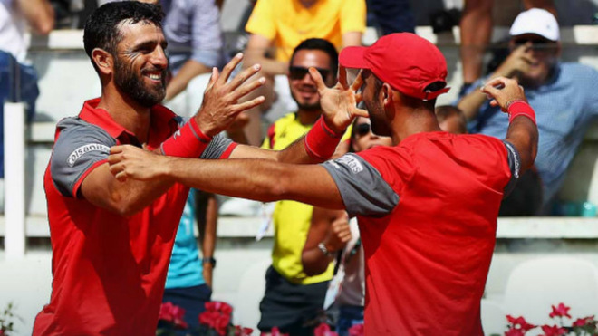 Farah y Cabal celebrando un punto